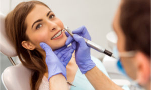 The dentist performs the crossbite treatment.